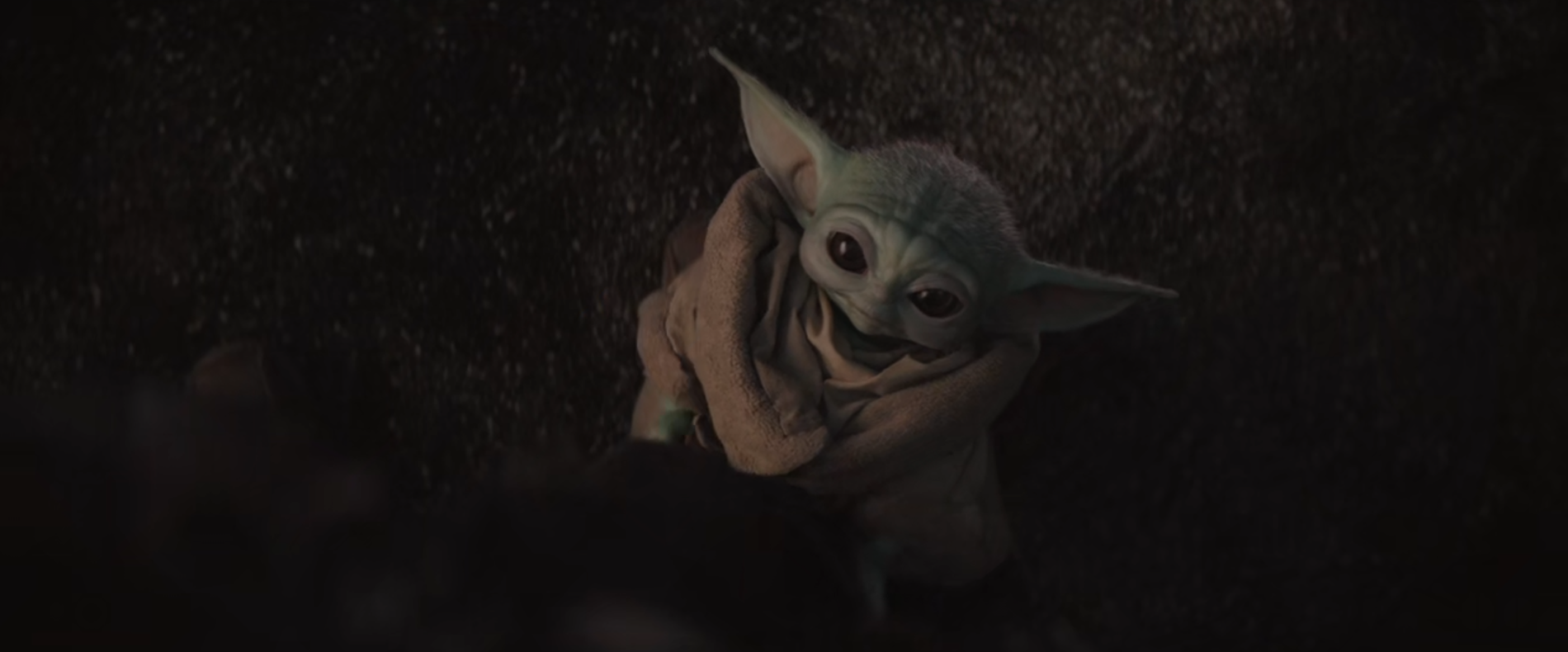 This meme features a still image from the Star Wars franchise, specifically a scene with the character of "Baby Yoda" from the Disney+ series "The Mandalorian". The image shows Baby Yoda looking up at someone with a curious expression. The text "When you finally understand what's going on" appears above the image.